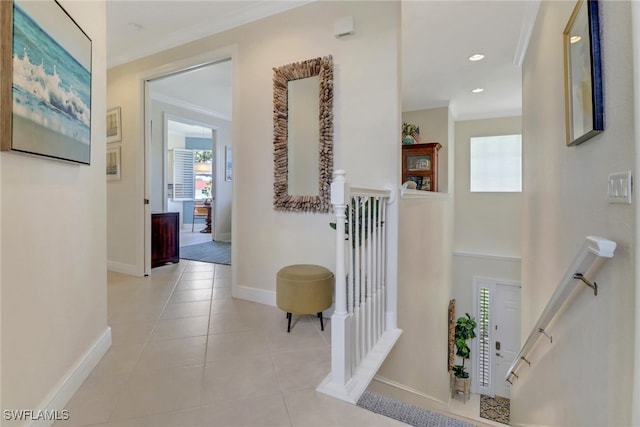 hallway with plenty of natural light, light tile patterned floors, baseboards, crown molding, and recessed lighting