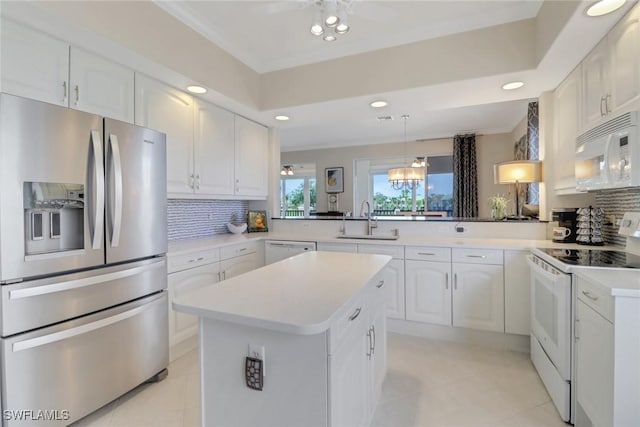 kitchen with white appliances, a sink, backsplash, light tile patterned flooring, and recessed lighting