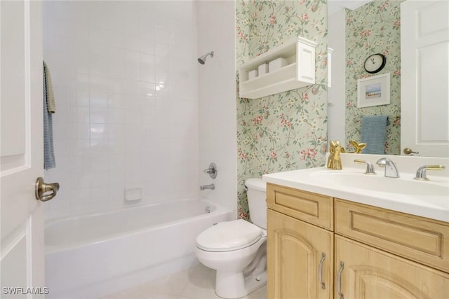 bathroom featuring wallpapered walls, toilet, vanity, and tub / shower combination