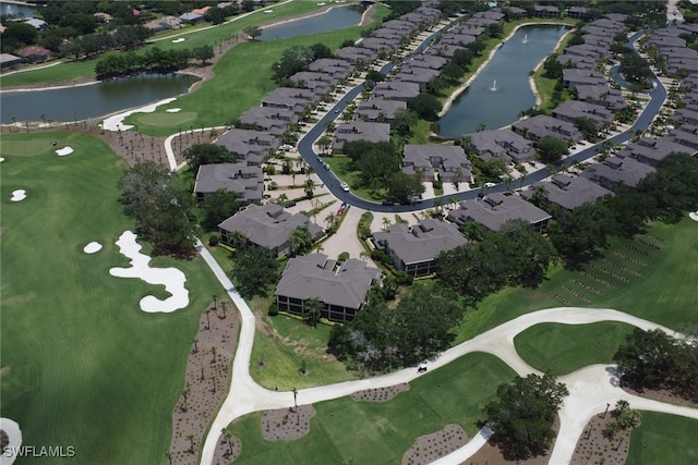 aerial overview of property's location with a large body of water, a golf club, and nearby suburban area