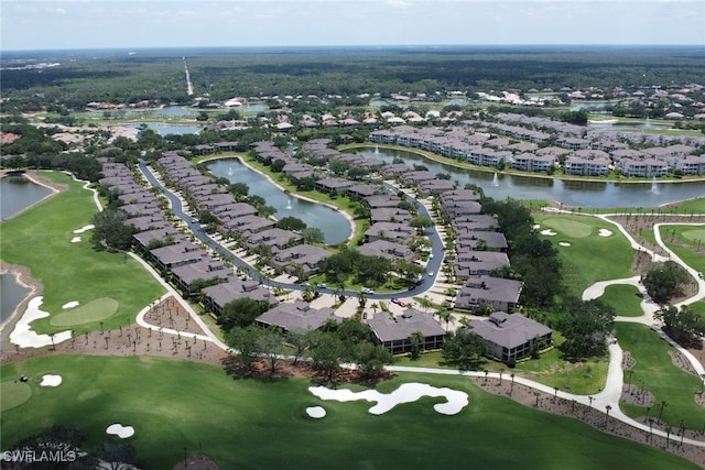 aerial overview of property's location featuring nearby suburban area, a local golf course, and a nearby body of water