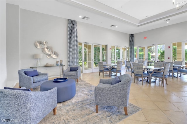 community lobby featuring a towering ceiling and recessed lighting