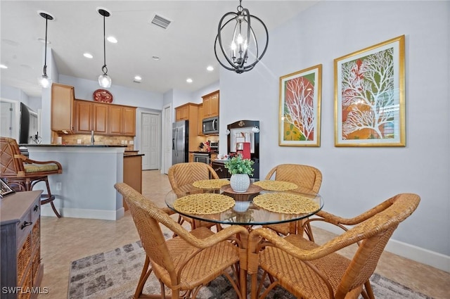 11265 Suffield St, Fort Myers, FL 33913 - dining space featuring a chandelier, recessed lighting, and baseboards