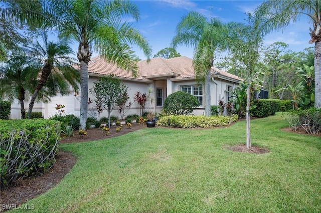 11265 Suffield St, Fort Myers, FL 33913 - ranch-style home featuring stucco siding, a front yard, a garage, and a tiled roof