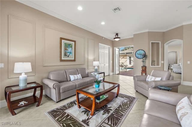 3417 Marbella Ct, Bonita Springs, FL 34134 - living room featuring arched walkways, light tile patterned floors, baseboards, ornamental molding, and recessed lighting