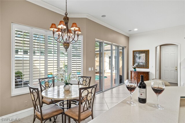 3417 Marbella Ct, Bonita Springs, FL 34134 - dining space with a chandelier, crown molding, tile patterned flooring, recessed lighting, and baseboards