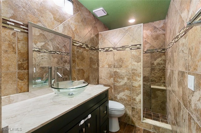 681 23rd St NW, Naples, FL 34120 - full bath featuring vanity, toilet, tile walls, and a walk in shower