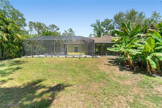 681 23rd St NW, Naples, FL 34120 - view of green lawn featuring glass enclosure