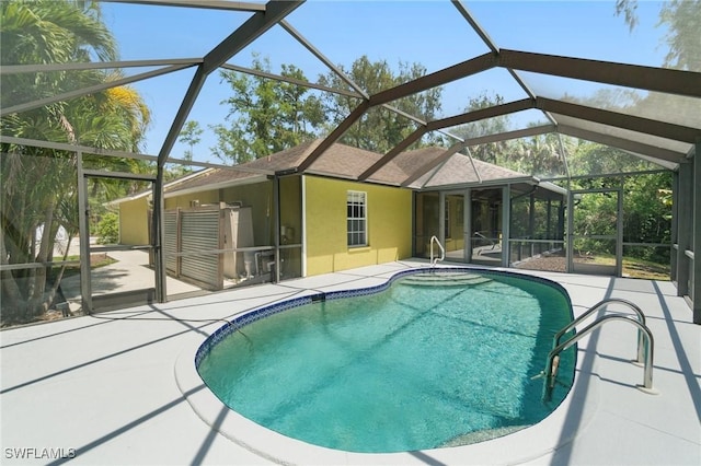 681 23rd St NW, Naples, FL 34120 - swimming pool featuring a patio and a lanai