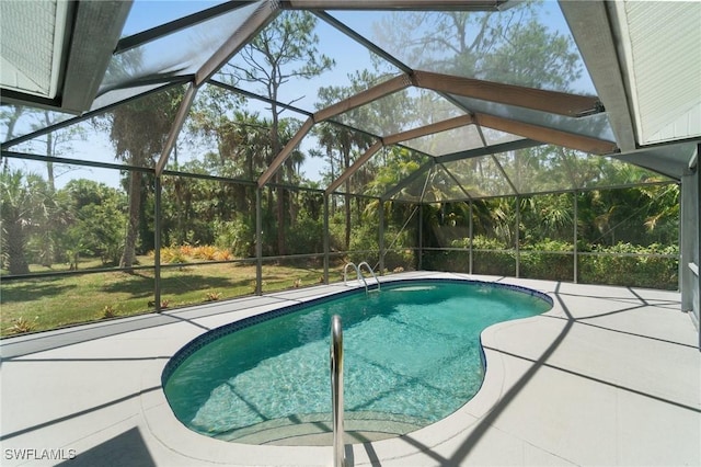 681 23rd St NW, Naples, FL 34120 - swimming pool featuring a patio area and glass enclosure