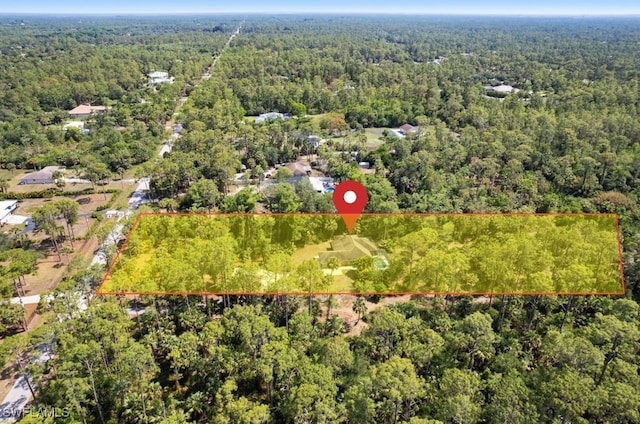 681 23rd St NW, Naples, FL 34120 - aerial view of property's location with a forest and property parcel outlined