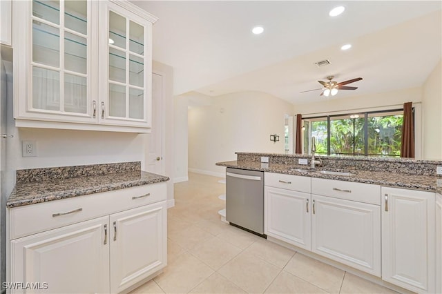 4910 SW 17th Pl Unit 4B, Cape Coral, FL 33914 - kitchen with dishwasher, a ceiling fan, glass insert cabinets, white cabinets, and dark stone countertops