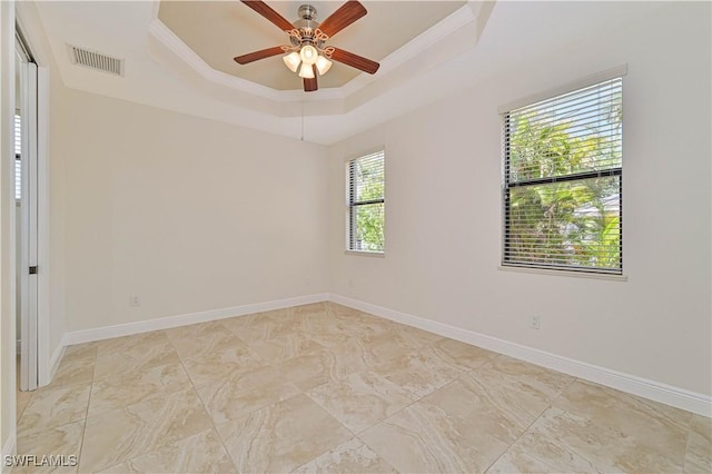 4910 SW 17th Pl Unit 4B, Cape Coral, FL 33914 - empty room featuring a tray ceiling, ceiling fan, and ornamental molding