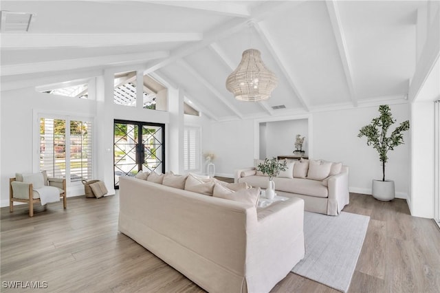 645 Park Shore Dr, Naples, FL 34103 - living room featuring a chandelier, light wood-style flooring, and baseboards