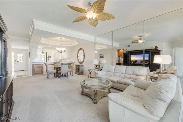 8015 Tiger Cv Unit 204, Naples, FL 34113 - living room featuring ceiling fan, a raised ceiling, crown molding, a chandelier, and light carpet