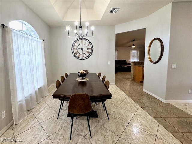 2639 SW 5th St, Cape Coral, FL 33991 - dining area with a chandelier, light tile patterned flooring, baseboards, and a tray ceiling