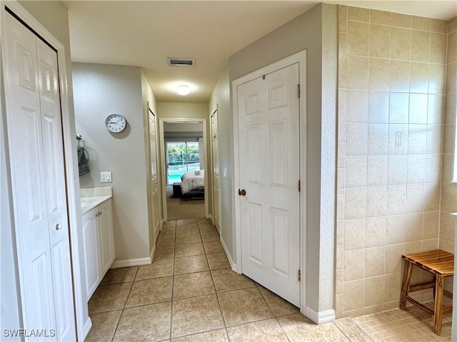 2639 SW 5th St, Cape Coral, FL 33991 - full bath with tile patterned floors, ensuite bath, baseboards, and vanity
