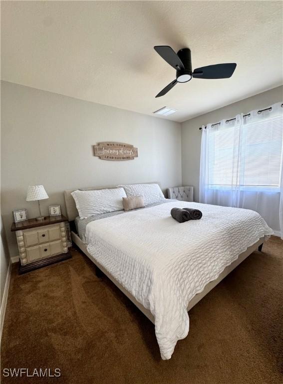 2639 SW 5th St, Cape Coral, FL 33991 - bedroom featuring carpet, baseboards, and a ceiling fan