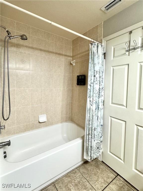2639 SW 5th St, Cape Coral, FL 33991 - full bathroom featuring tile patterned flooring and shower / bath combination with curtain