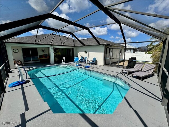 2639 SW 5th St, Cape Coral, FL 33991 - swimming pool with a patio area, glass enclosure, and fence
