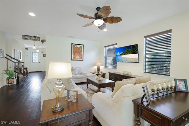 living room featuring hardwood / wood-style flooring, a ceiling fan, stairway, recessed lighting, and baseboards