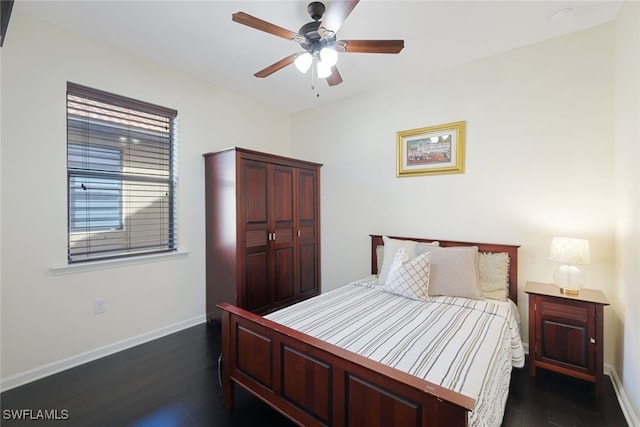 bedroom featuring dark wood finished floors, baseboards, and ceiling fan