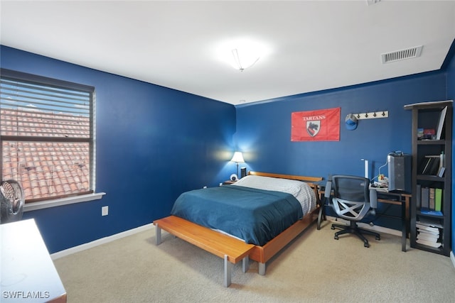 carpeted bedroom featuring baseboards