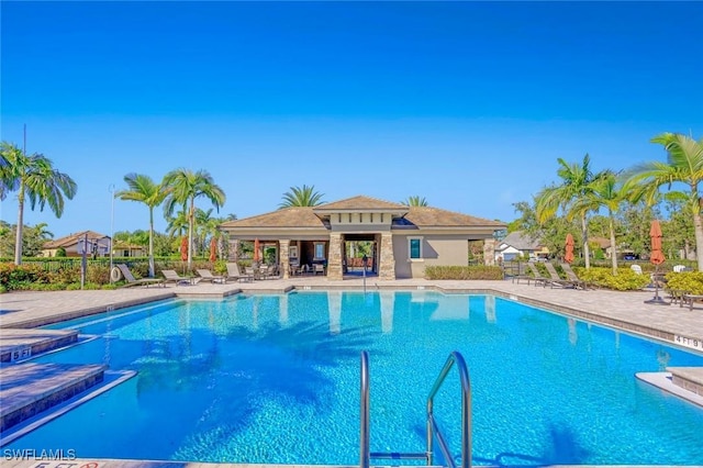 community pool with a patio area