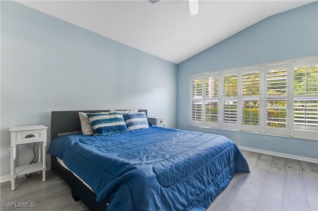 2664 Astwood Ct, Cape Coral, FL 33991 - bedroom with wood finished floors, vaulted ceiling, baseboards, and a ceiling fan