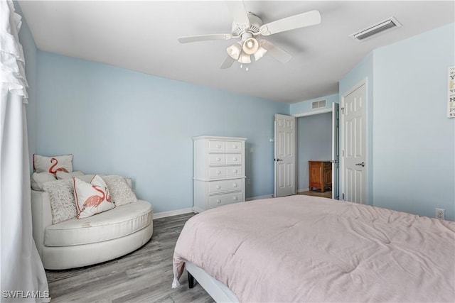2664 Astwood Ct, Cape Coral, FL 33991 - bedroom with wood finished floors, baseboards, and ceiling fan