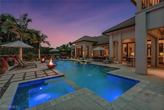 714 Killdeer Pl, Naples, FL 34108 - view of swimming pool featuring a patio, a pool with connected hot tub, and outdoor dining area