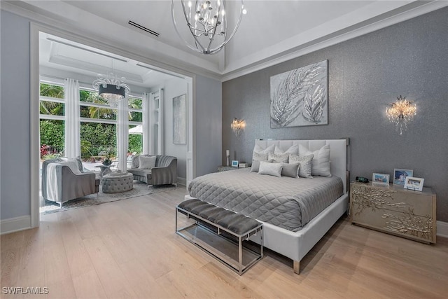 714 Killdeer Pl, Naples, FL 34108 - bedroom featuring a chandelier, wood finished floors, baseboards, and a tray ceiling