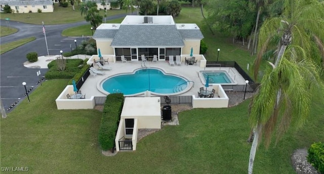 community pool with a patio area