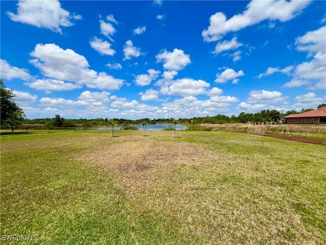 8000 Fountain Mist Blvd, Lehigh Acres, FL 33972 - view of grassy yard featuring a water view