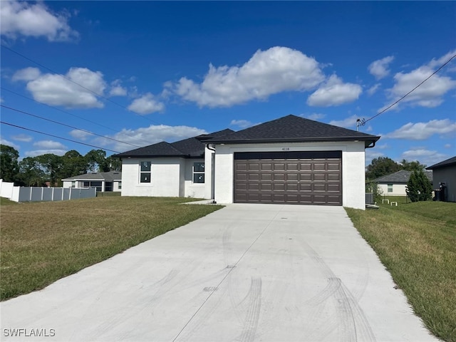4118 4th St SW, Lehigh Acres, FL 33976 - view of front of home with a garage, concrete driveway, stucco siding, and roof with shingles
