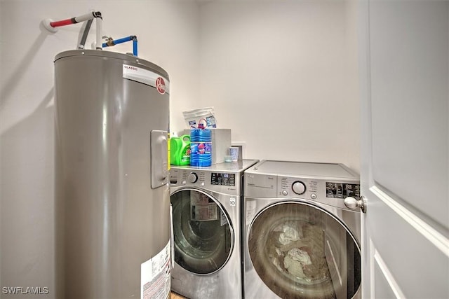 5007 W Hummingbird Dr, Labelle, FL 33935 - laundry area with electric water heater and independent washer and dryer