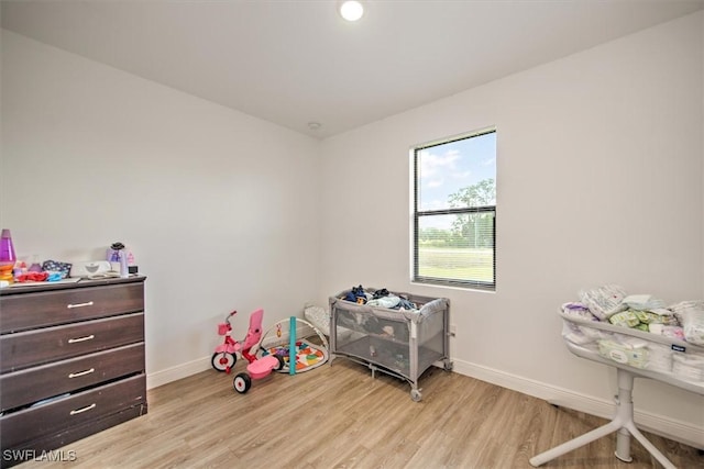 5007 W Hummingbird Dr, Labelle, FL 33935 - rec room with baseboards and light wood-type flooring
