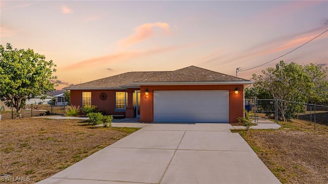 209 Magellan St, Fort Myers, FL 33913 - view of front of home featuring fence, a garage, concrete driveway, a gate, and stucco siding