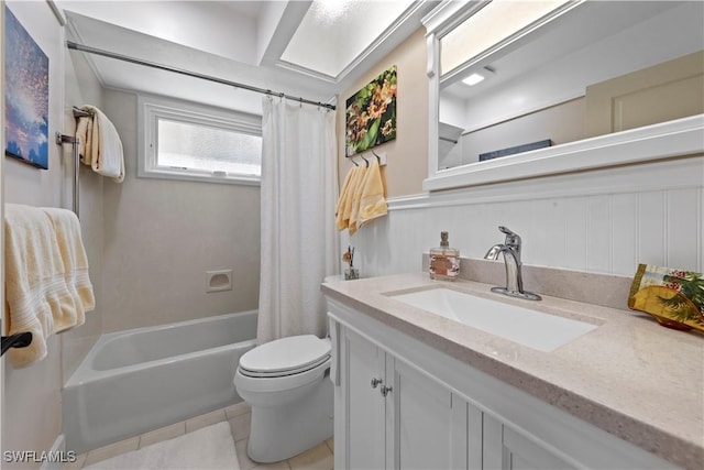 bathroom with toilet, tile patterned flooring, shower / bathtub combination with curtain, and vanity