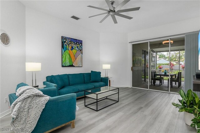 170 Vista Ln, Naples, FL 34119 - living area featuring a ceiling fan, wood finished floors, and baseboards