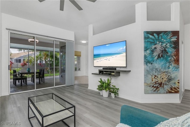 170 Vista Ln, Naples, FL 34119 - living room featuring wood finished floors, ceiling fan, and baseboards