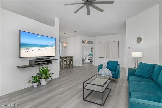 170 Vista Ln, Naples, FL 34119 - living area featuring wood finished floors, a ceiling fan, and baseboards