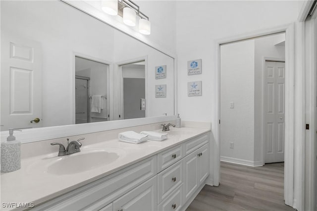 170 Vista Ln, Naples, FL 34119 - full bathroom featuring double vanity and wood finished floors