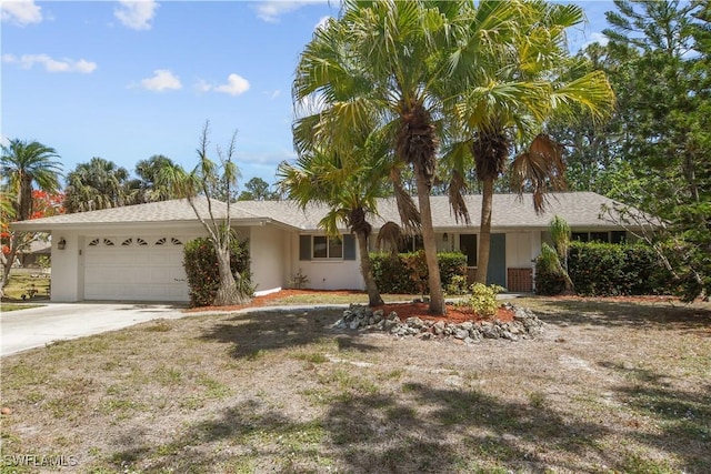 28058 Oak Ln, Bonita Springs, FL 34135 - single story home featuring a garage, concrete driveway, and stucco siding