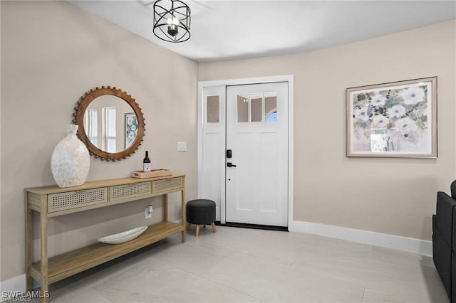 entryway featuring baseboards