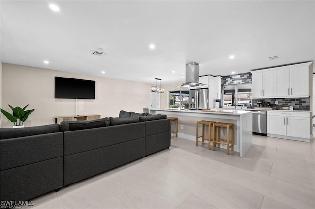 living area with recessed lighting and baseboards