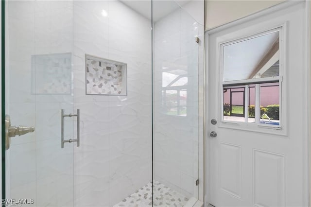 full bath with a shower stall