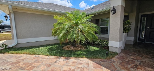1948 Redmont Ave, Lehigh Acres, FL 33972 - view of property exterior with stucco siding and roof with shingles