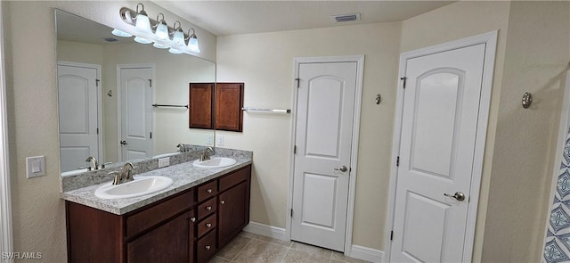 1948 Redmont Ave, Lehigh Acres, FL 33972 - bathroom with double vanity and tile patterned flooring