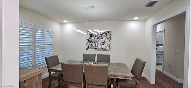 1948 Redmont Ave, Lehigh Acres, FL 33972 - carpeted dining space featuring a chandelier, baseboards, and recessed lighting
